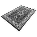 A stylish Turkish machine-made rug featuring a classic Persian floral medallion design. The elegant central motif is surrounded by detailed floral patterns, creating a balanced and timeless look. The deep navy background paired with soft ivory and grey tones gives it a clean, sophisticated feel. Durable and easy to maintain, this rug is perfect for everyday living while adding a refined touch to any space. Color: Grey Size: 230 x 160cm Make: Machine-made Made In: Turkey Material: Polyester Condition: New Note to Customers: Carefully measure your space before purchasing to ensure the rug fits your desired area. Colors may slightly vary due to lighting and monitor settings.