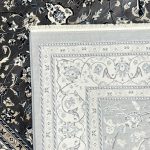 A stylish Turkish machine-made rug featuring a classic Persian floral medallion design. The elegant central motif is surrounded by detailed floral patterns, creating a balanced and timeless look. The deep navy background paired with soft ivory and grey tones gives it a clean, sophisticated feel. Durable and easy to maintain, this rug is perfect for everyday living while adding a refined touch to any space. Color: Grey Size: 230 x 160cm Make: Machine-made Made In: Turkey Material: Polyester Condition: New Note to Customers: Carefully measure your space before purchasing to ensure the rug fits your desired area. Colors may slightly vary due to lighting and monitor settings.